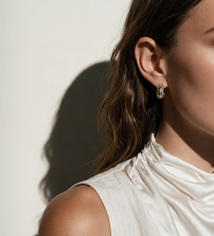 chunky gold hoop earrings on model, dome hoop earrings, crystal c hoop earrings, thick gold huggie earrings, sparkly gold hoops, statement huggie earrings, matching ring and earrings set, chunky gold dome ring, cubic zirconia hoop earrings, gold dome earrings, bold gold jewelry set, women’s chunky hoops