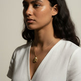 gold pharaoh necklace, Egyptian mask pendant necklace, King Tut necklace, statement gold necklace, Egyptian jewelry, textured gold necklace, historical pendant necklace, on-model necklace photography