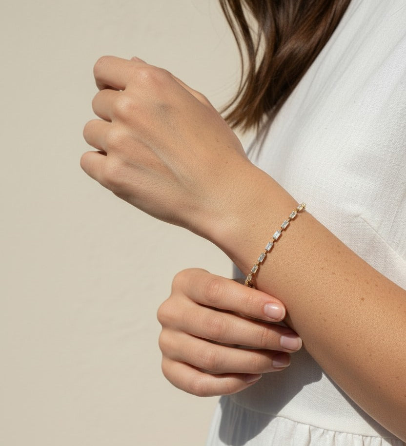 CZ tennis bracelet on model, baguette round cut bracelet wrist shot, cubic zirconia bracelet lifestyle, sparkly tennis bracelet on wrist, gold CZ bracelet on model, matching tennis jewelry, dainty tennis bracelet, statement CZ bracelet photo