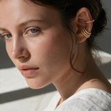 triple band ear cuff, pavé ear cuff, twisted rope ear cuff, gold ear cuff set, no piercing ear cuff, stacked ear cuffs, layered ear jewelry, crystal ear cuff on model