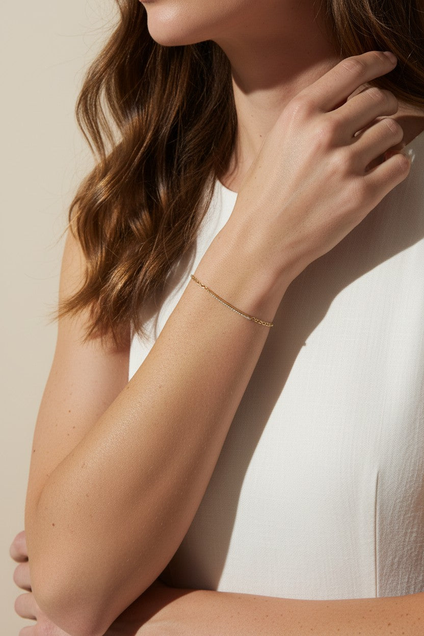 CZ bar bracelet on model, cubic zirconia bracelet wrist shot, gold bracelet close-up, sparkly bar bracelet on model, dainty CZ bracelet, layering bracelet lifestyle, gold overlay bracelet on wrist, minimalist CZ jewelry