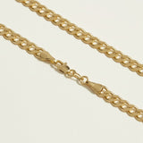 curb chain necklace flat lay, gold curb link necklace detail, classic chain necklace, layered chain necklace, clasp detail necklace, polished chain necklace, gold link necklace, layering necklace set