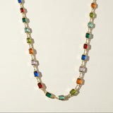 rainbow station necklace, multicolor gemstone necklace, emerald cut crystal necklace, colorful bezel necklace, gold bezel chain necklace, birthstone-style necklace, candy color necklace, layering necklace, adjustable gold necklace, jewel tone necklace, statement station necklace, women’s colorful necklace