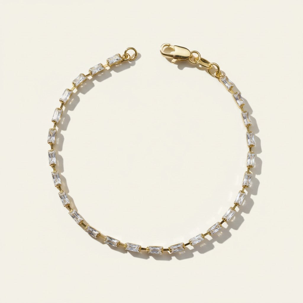 baguette CZ tennis bracelet, all baguette cubic zirconia bracelet, gold baguette bracelet flat lay, art deco tennis bracelet, sparkly baguette bracelet, emerald cut CZ bracelet, tennis bracelet clasp detail, uniform stone tennis bracelet