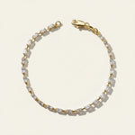 baguette CZ tennis bracelet, all baguette cubic zirconia bracelet, gold baguette bracelet flat lay, art deco tennis bracelet, sparkly baguette bracelet, emerald cut CZ bracelet, tennis bracelet clasp detail, uniform stone tennis bracelet