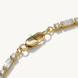 CZ tennis bracelet, baguette round cut bracelet, cubic zirconia tennis bracelet, matching tennis jewelry set, gold tennis bracelet detail, sparkly CZ bracelet flat lay, prong set CZ bracelet, tennis bracelet clasp detail