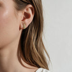 pineapple stud earrings, pavé pineapple earrings, gold pineapple studs, tropical stud earrings, crystal fruit earrings, dainty novelty earrings, summer stud earrings, pineapple earrings on model