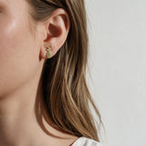 pineapple stud earrings, pavé pineapple earrings, gold pineapple studs, tropical stud earrings, crystal fruit earrings, dainty novelty earrings, summer stud earrings, pineapple earrings on model