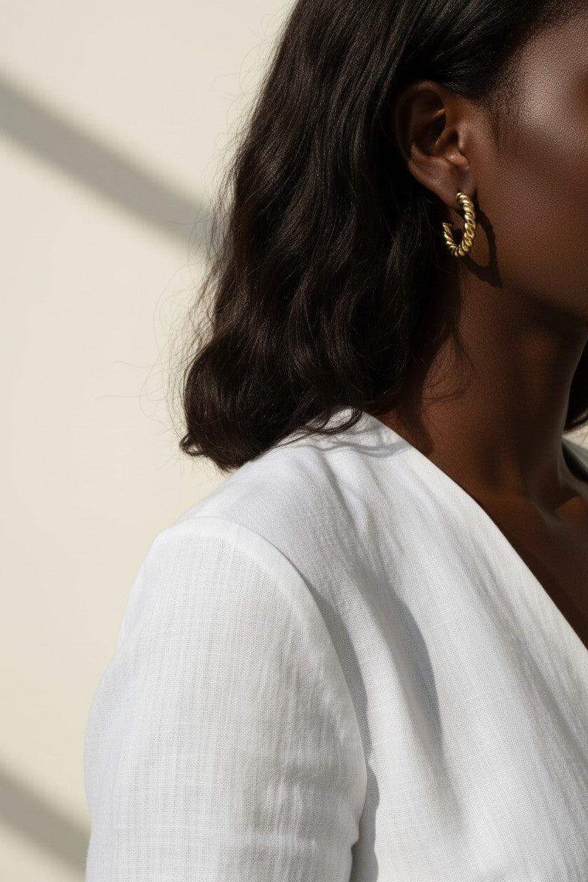 twisted rope hoop earrings, gold rope texture hoops, small twisted hoops on model, textured gold hoop earrings, everyday gold hoops, sculptural rope earrings, statement gold hoops, polished twisted earring