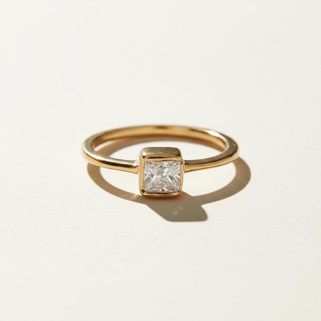 solitaire CZ ring flat lay, princess cut ring detail, square stone gold ring, bezel set CZ ring, 18k gold overlay ring, engagement style ring, simple solitaire ring, gold ring with square stone