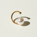 pearl ear cuff, gold ear cuff with pearl, sculptural ear cuff, asymmetric ear cuff, avant-garde pearl jewelry, no-piercing ear cuff, modern pearl earring, artistic gold ear cuff