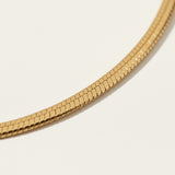 herringbone chain anklet flat lay, gold anklet construction detail, 18k gold overlay anklet, adjustable gold ankle chain, herringbone anklet clasp, matching jewelry set anklet, flat link ankle chain, gold anklet macro detail