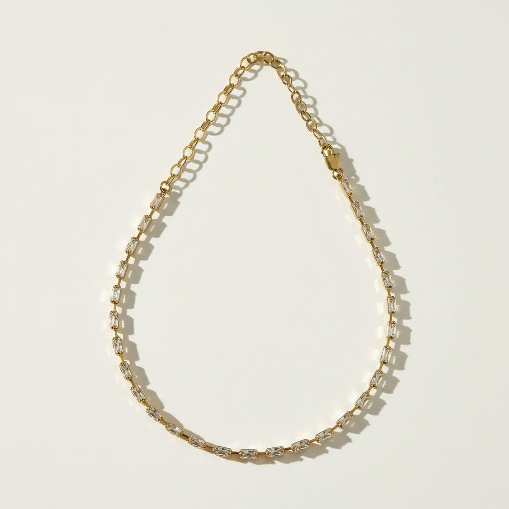 Milano Marvel Choker flat lay, baguette CZ choker detail, gold choker necklace, sideway baguette necklace, 18k gold overlay choker, statement choker necklace, sparkle choker, luxury choker necklace