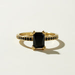 black stone cocktail ring, emerald cut ring gold, black onyx ring, vintage style statement ring, art deco cocktail ring, pavé black stone ring, gold statement ring on-model, dark gemstone ring