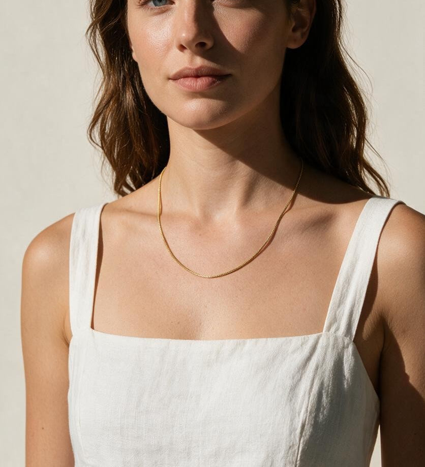 fine gold box chain necklace on model, thin gold chain necklace, dainty gold necklace, delicate box chain, layering chain necklace, collarbone necklace, minimalist gold necklace, everyday gold chain, simple gold chain necklace, lightweight gold necklace, summer linen style jewelry, gift for her