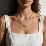 gold rolo chain necklace on model, round clasp necklace, charm holder necklace, spring ring clasp necklace, gold chain with ring clasp, modern gold chain necklace, front clasp necklace, layering chain necklace, everyday gold necklace, minimalist gold necklace, interchangeable pendant necklace, women’s gold chain necklace