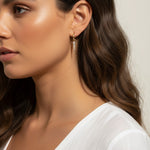 CZ spear charm worn, gold hoop with charm styled, interchangeable earring charm fit, cubic zirconia charm on model, customizable hoop earring lifestyle photo, gold spear charm close-up