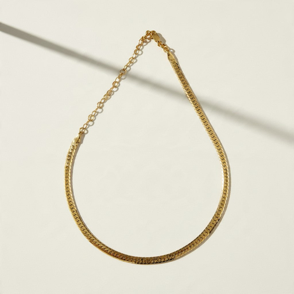gold herringbone necklace, flat herringbone chain, gold snake chain necklace, adjustable herringbone necklace, shiny gold chain choker, lobster clasp necklace with extender, flat gold chain, layering necklace, everyday gold necklace, collarbone chain necklace, women’s gold chain, timeless gold jewelry
