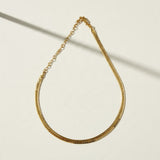 gold herringbone necklace, flat herringbone chain, gold snake chain necklace, adjustable herringbone necklace, shiny gold chain choker, lobster clasp necklace with extender, flat gold chain, layering necklace, everyday gold necklace, collarbone chain necklace, women’s gold chain, timeless gold jewelry