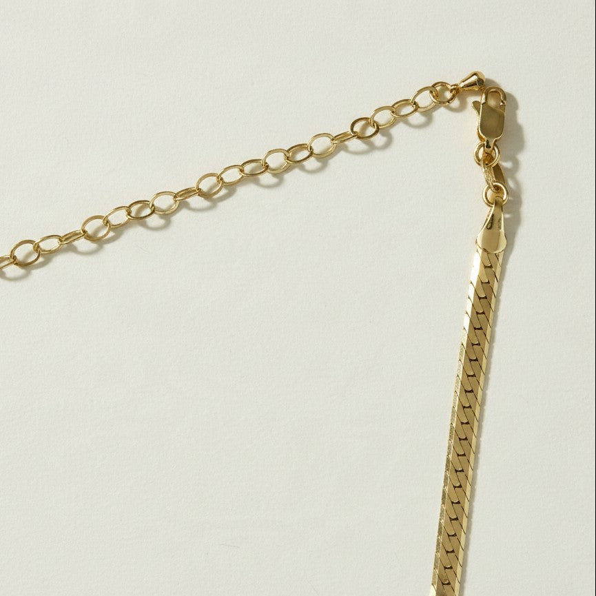 gold herringbone necklace, flat herringbone chain, gold snake chain necklace, adjustable herringbone necklace, shiny gold chain choker, lobster clasp necklace with extender, flat gold chain, layering necklace, everyday gold necklace, collarbone chain necklace, women’s gold chain, timeless gold jewelry
