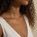gold beaded choker, dainty gold choker necklace, beaded chain choker on model, minimalist gold choker, layering choker necklace, thin gold choker, delicate beaded necklace, gold choker close-up