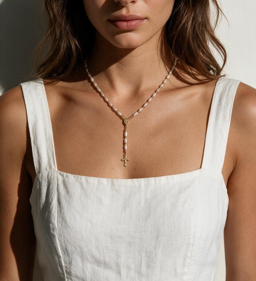 pearl rosary necklace on model, freshwater pearl rosary necklace, gold bead rosary necklace, rosary style necklace, pearl cross necklace, Catholic jewelry, religious necklace, first communion gift, confirmation gift, baptism gift, vintage-style pearl necklace, collarbone necklace, gift for her