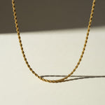 gold rope chain necklace, twisted rope chain, classic gold chain, unisex gold necklace, lobster clasp chain necklace, everyday gold chain, layering chain necklace, gold chain for pendants, medium rope chain, timeless gold jewelry, men’s gold chain, women’s gold chain