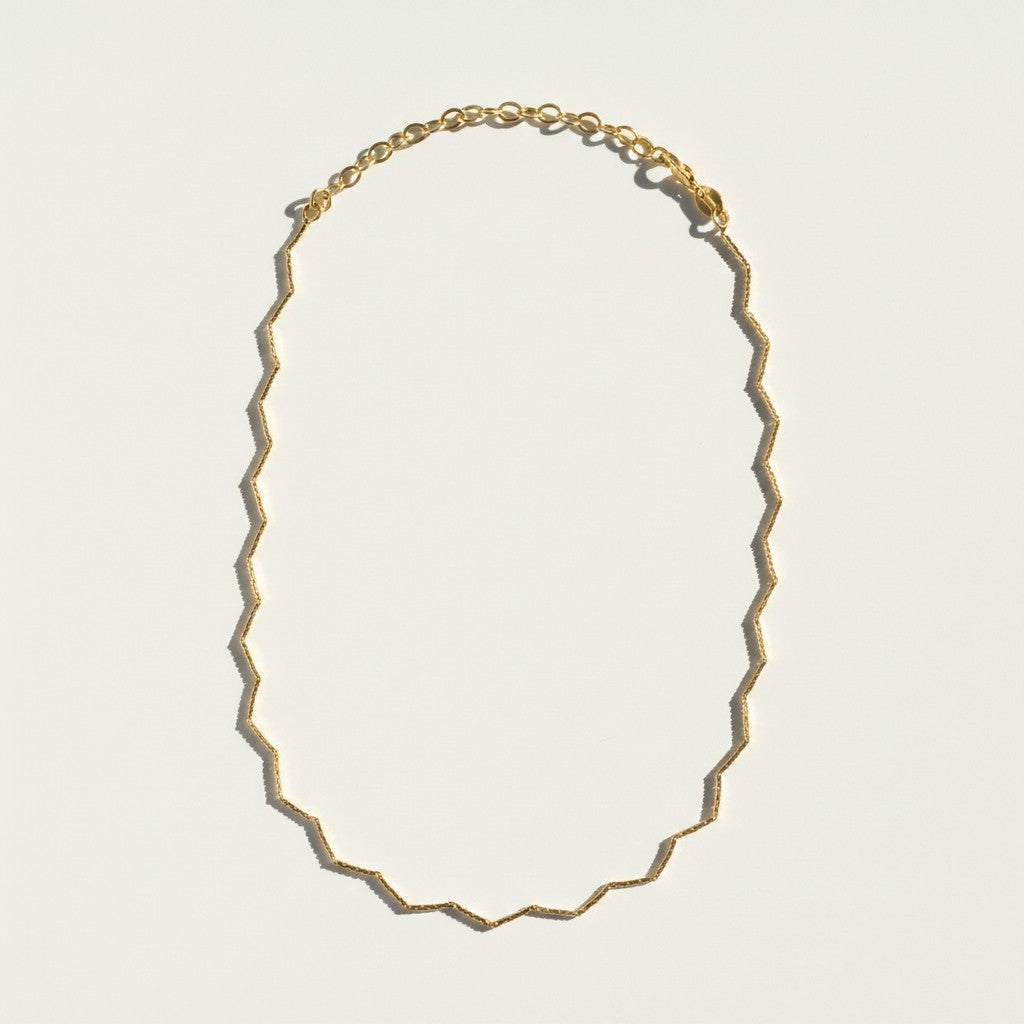 zig zag choker flat lay, geometric gold choker, diamond cut zigzag necklace, textured gold choker, adjustable geometric choker, 18k gold filled choker, chevron chain necklace, gold choker macro detail