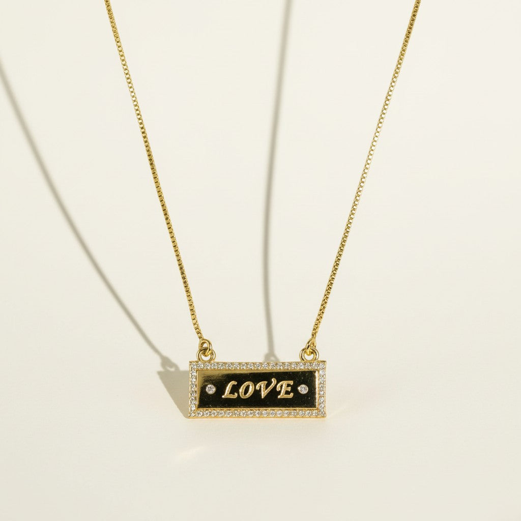 gold LOVE necklace, LOVE bar necklace, engraved bar pendant necklace, gold nameplate necklace, cubic zirconia pavé pendant, box chain necklace, heart extender chain necklace, adjustable gold necklace, word necklace, anniversary gift necklace, Valentine's Day jewelry, gift for her, romantic gold jewelry, dainty gold pendant