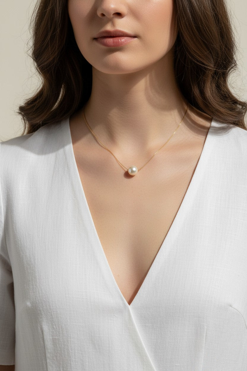 single pearl necklace, pearl pendant necklace, gold chain pearl necklace, minimalist pearl jewelry, classic pearl necklace, everyday pearl necklace, floating pearl necklace, on-model necklace photography
