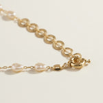 baroque pearl necklace, front toggle clasp necklace, freshwater pearl chain necklace, gold and pearl necklace on model, organic pearl necklace, statement clasp pearl necklace, dainty pearl choker, pearl necklace close-up