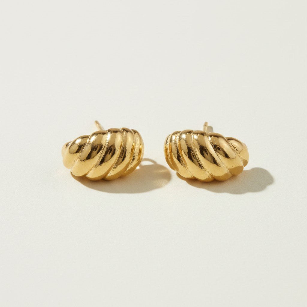 ribbed gold hoop earrings flat lay, fluted gold dome earrings detail, croissant hoop earrings, sculptural ribbed earrings, high polish gold hoops, textured gold stud earrings, retro gold earrings, gold dome earring construction