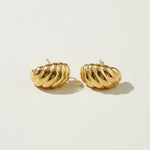 ribbed gold hoop earrings flat lay, fluted gold dome earrings detail, croissant hoop earrings, sculptural ribbed earrings, high polish gold hoops, textured gold stud earrings, retro gold earrings, gold dome earring construction