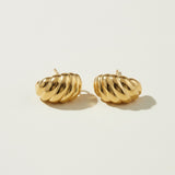 ribbed gold hoop earrings flat lay, fluted gold dome earrings detail, croissant hoop earrings, sculptural ribbed earrings, high polish gold hoops, textured gold stud earrings, retro gold earrings, gold dome earring construction