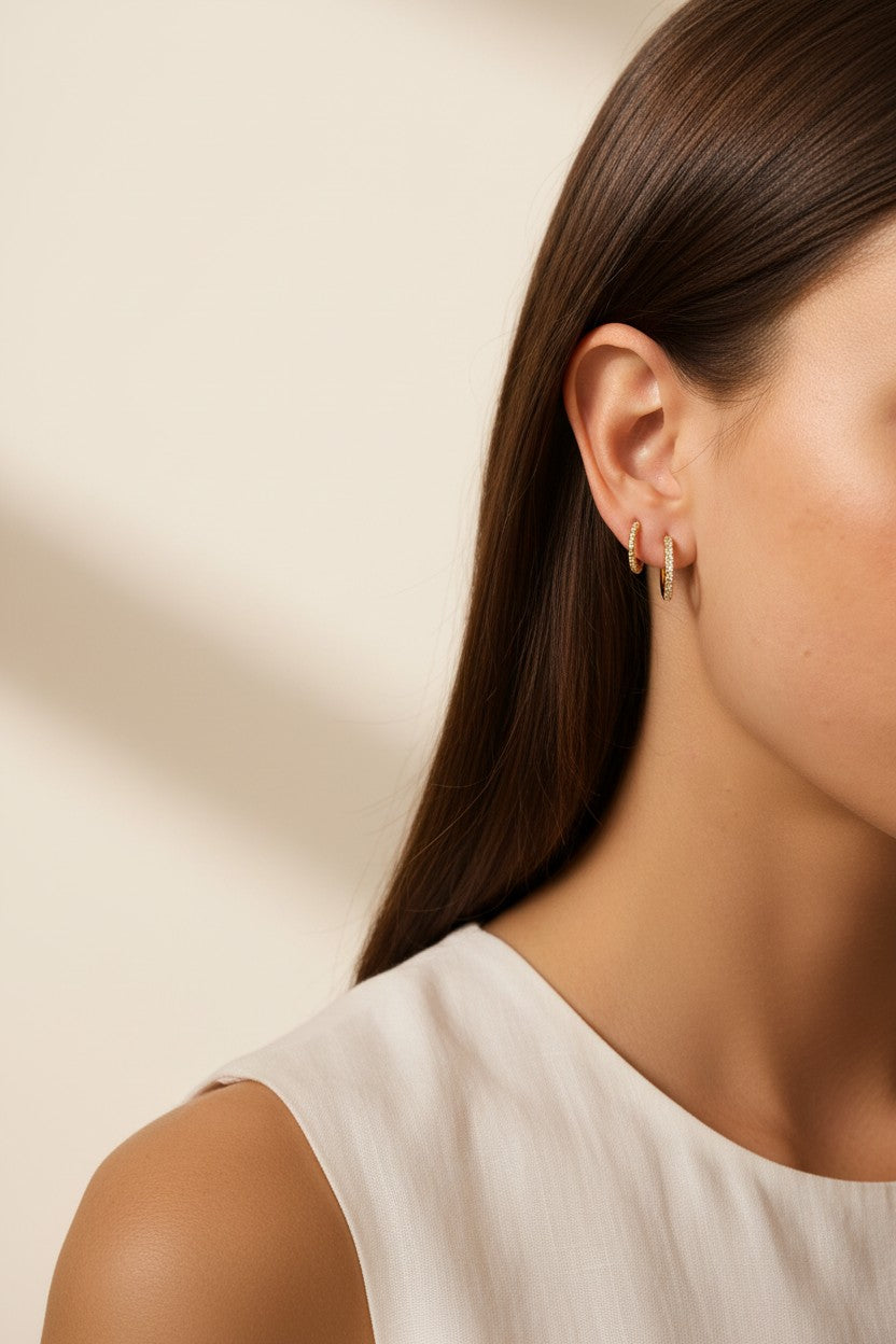 pavé huggie hoop earrings, gold huggie earrings on model, stacked hoop earrings, small pavé hoop earrings, everyday gold hoops, ear stack earrings, sparkle huggie hoops, minimalist gold hoops