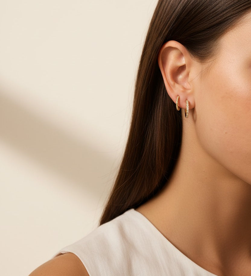 pavé huggie hoop earrings, gold huggie earrings on model, stacked hoop earrings, small pavé hoop earrings, everyday gold hoops, ear stack earrings, sparkle huggie hoops, minimalist gold hoops