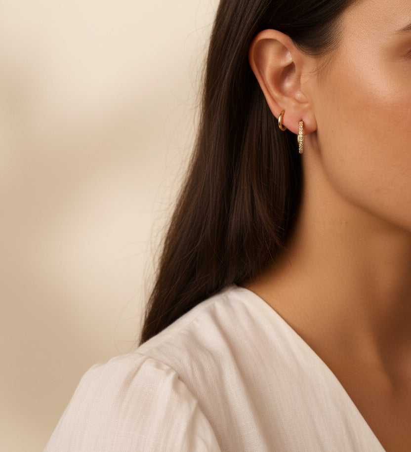 pavé huggie hoop earrings, gold huggie earrings on model, stacked hoop earrings, small pavé hoop earrings, everyday gold hoops, ear stack earrings, sparkle huggie hoops, minimalist gold hoops