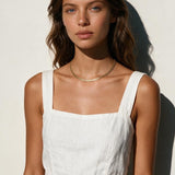 gold herringbone necklace on model, flat gold chain necklace, shiny herringbone chain, collarbone length necklace, minimalist gold necklace, everyday gold chain, layering chain necklace, flat snake chain, adjustable gold necklace, sleek gold jewelry, women’s gold chain necklace, summer gold necklace