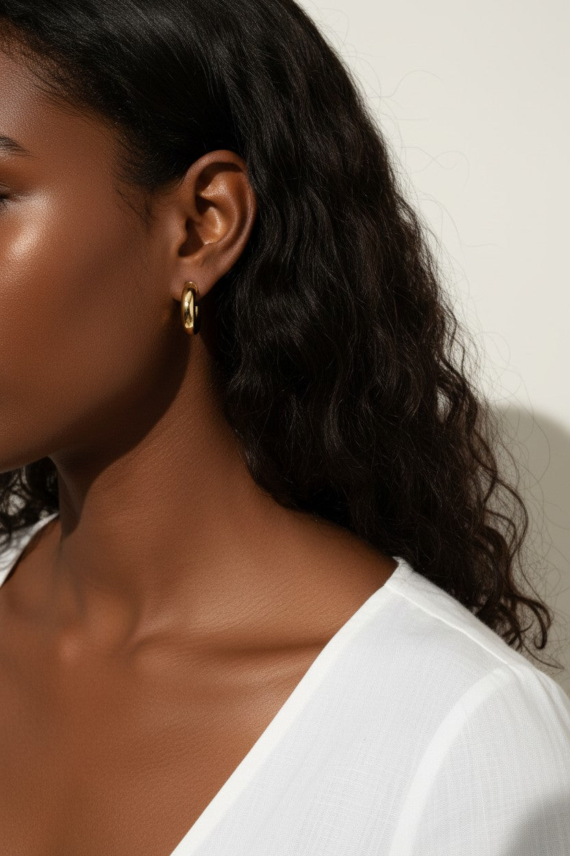 chunky round hoop earrings, gold tube hoop earrings, bold gold hoops on model, small chunky hoops, polished round hoops, statement gold hoops, everyday hoop earrings, thick gold hoop earrings