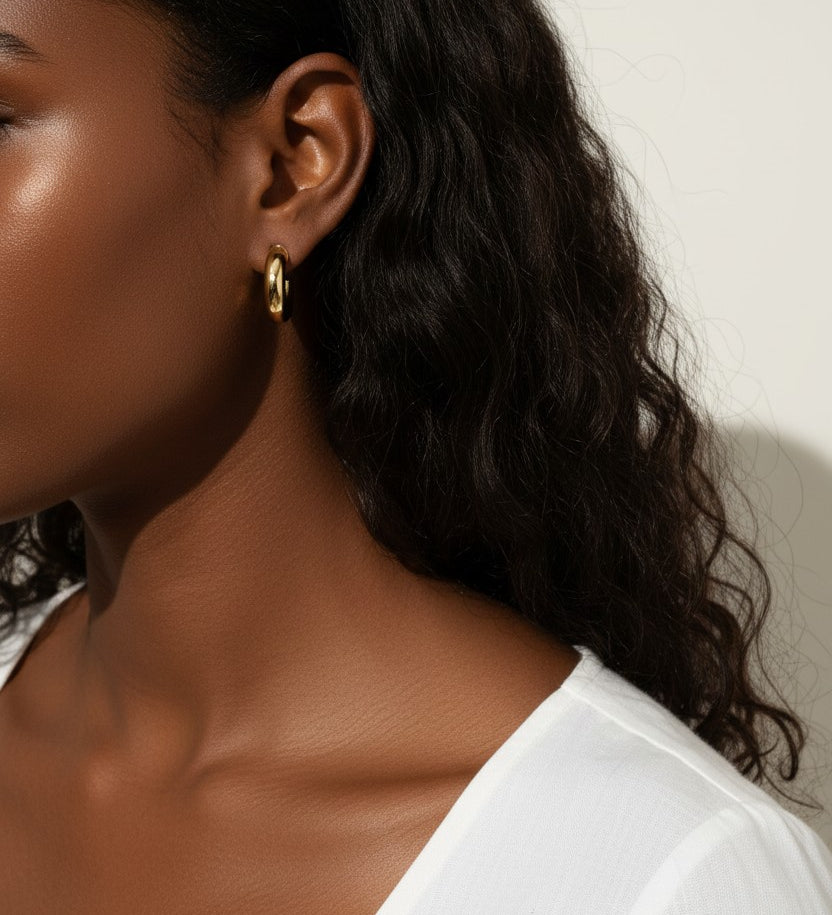 chunky round hoop earrings, gold tube hoop earrings, bold gold hoops on model, small chunky hoops, polished round hoops, statement gold hoops, everyday hoop earrings, thick gold hoop earrings