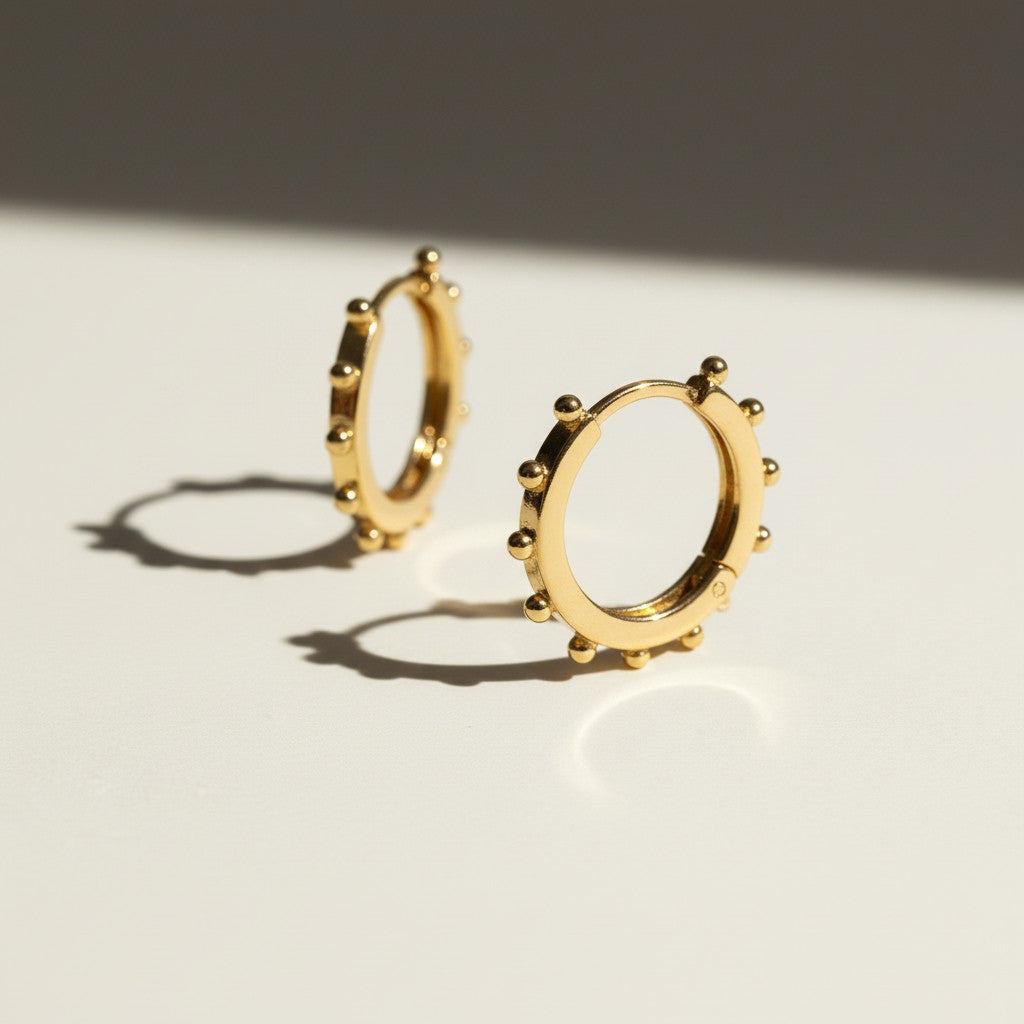 beaded hoop earrings, studded gold hoops, 18K gold overlay hoop earrings, textured hoop earrings, statement hoop earrings, small gold hoops, bead detail earrings, hoop earrings flat lay