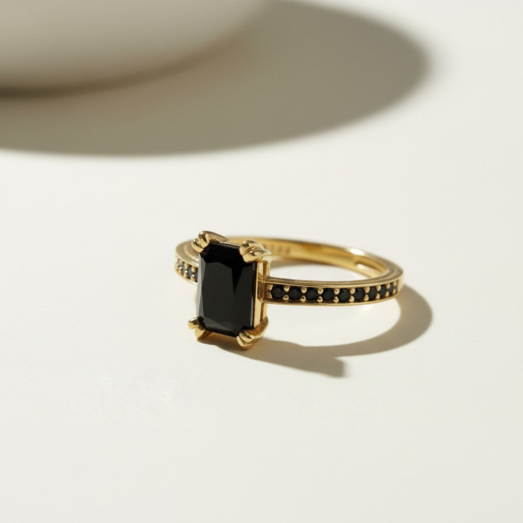 black stone cocktail ring, emerald cut ring gold, black onyx ring, vintage style statement ring, art deco cocktail ring, pavé black stone ring, gold statement ring on-model, dark gemstone ring