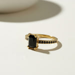 black stone cocktail ring, emerald cut ring gold, black onyx ring, vintage style statement ring, art deco cocktail ring, pavé black stone ring, gold statement ring on-model, dark gemstone ring