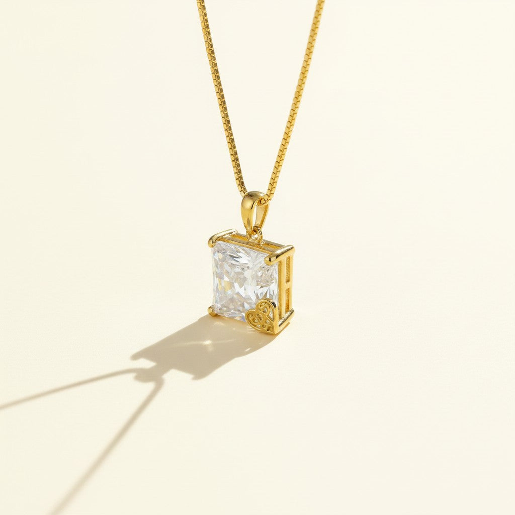 princess cut pendant necklace, crystal solitaire necklace, heart charm pendant, gold box chain necklace, square cut crystal necklace, statement solitaire pendant, dainty heart accent necklace