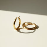 classic gold hoop earrings, gold tube hoop earrings, polished gold hoops, medium gold hoop earrings, thick gold hoops, hinged hoop earrings, latch back hoops, everyday gold hoops, timeless hoop earrings, minimalist gold hoops, lightweight chunky hoops, gift for her