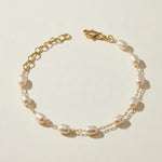 pearl station bracelet, wire wrapped pearl bracelet, oval pearl bracelet, gold and pearl bracelet, dainty pearl bracelet, adjustable pearl bracelet, rice pearl bracelet, lobster clasp pearl bracelet, bridal pearl bracelet, everyday pearl bracelet, layering bracelet, women’s pearl bracelet