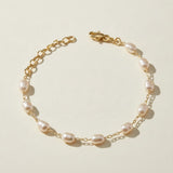 pearl station bracelet, wire wrapped pearl bracelet, oval pearl bracelet, gold and pearl bracelet, dainty pearl bracelet, adjustable pearl bracelet, rice pearl bracelet, lobster clasp pearl bracelet, bridal pearl bracelet, everyday pearl bracelet, layering bracelet, women’s pearl bracelet