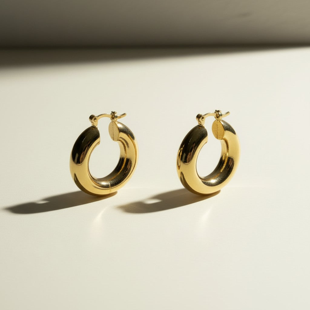 mini dome hoop earrings flat lay, small gold hoops detail, chunky mini hoops, rounded gold earrings, everyday small hoops, polished dome earrings, compact gold hoops, thick gold hoop earrings