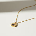 hamsa pendant necklace, gold coin necklace, hamsa coin pendant, blue crystal hamsa necklace, dainty gold pendant, protective charm necklace, round disc pendant necklace, hamsa necklace detail