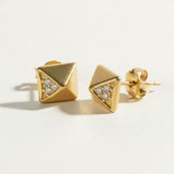 gold pyramid stud earrings, geometric stud earrings, matte gold studs, pyramid earrings with crystals, square stud earrings, minimalist gold studs, modern geometric earrings, cubic zirconia accent studs, edgy gold studs, everyday stud earrings, architectural earrings, women’s gold stud earrings